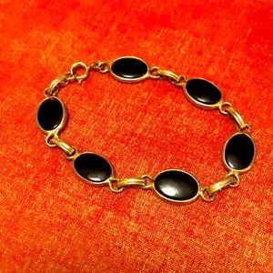 Bracelet gold and black, costume.